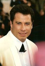 Formal event photo of a man in a white dinner jacket and bow tie